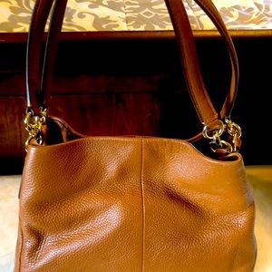 New, never used brown leather Coach satchel